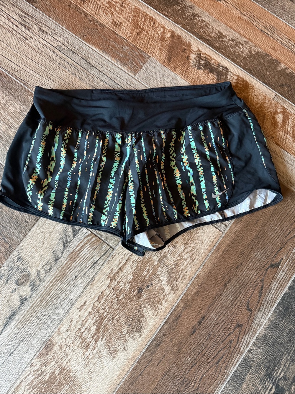 Nike Black Women's Athletic Shorts with Green and Aqua Stripe Detail